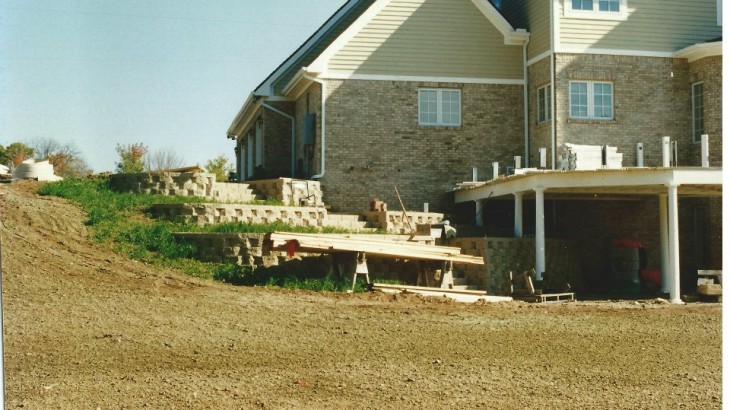 Brick stairs leading up the side of a brick house