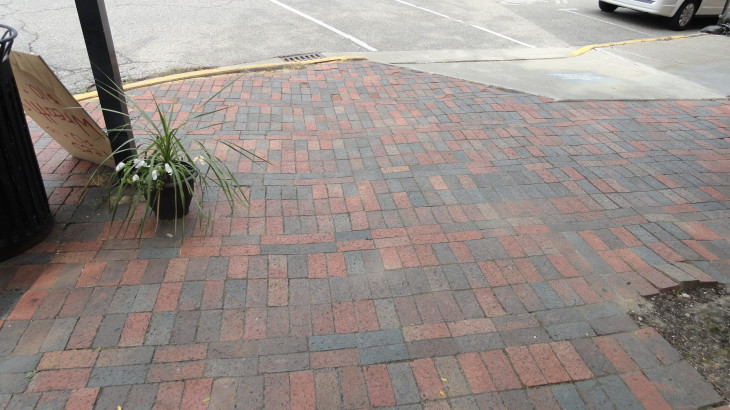 A corner of an urban area crafted from brick by Brick Paver Construction